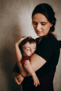 Mother holds baby in her arms