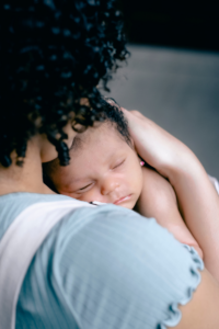 Mother sleep train with her infant