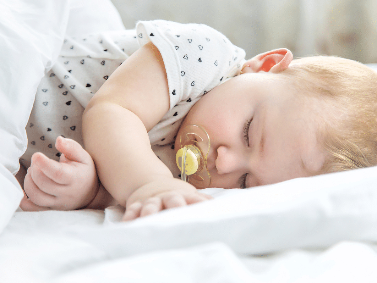 newborn sleeps on side