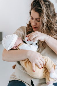 Mother is feeding an infant